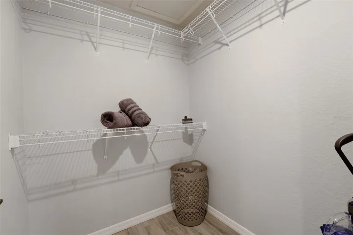 Walk in closet with built in shelving and storage space
