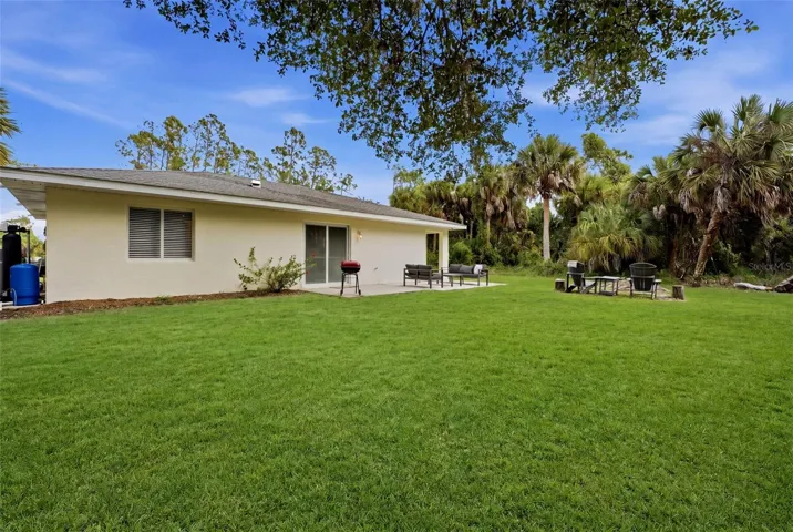 Rear exterior view of home and yard