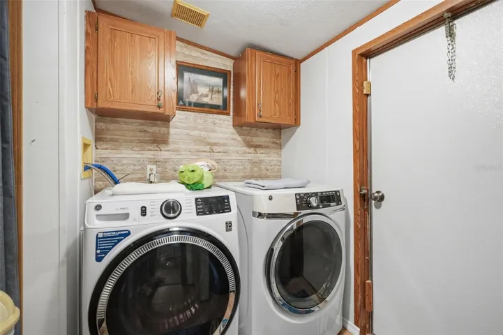 Laundry Room with door to backyard