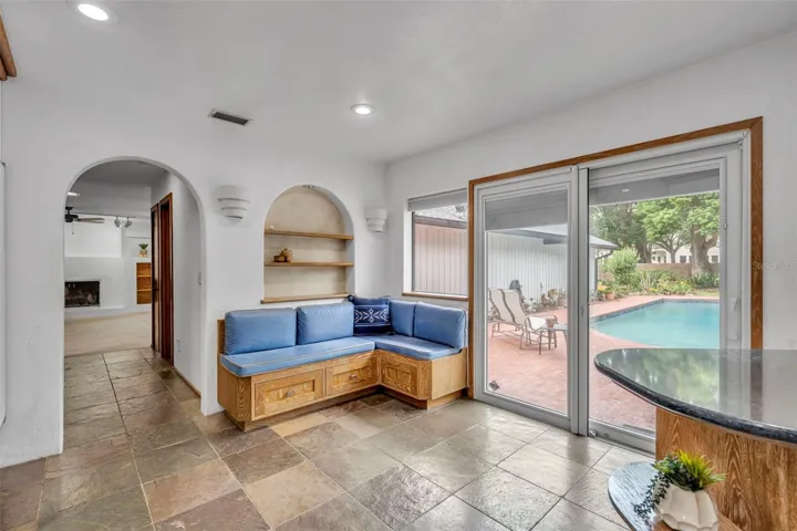 Banquet Style Seating for in-kitchen Dining. Sliders go out to pool. Great for Outside entertaining
