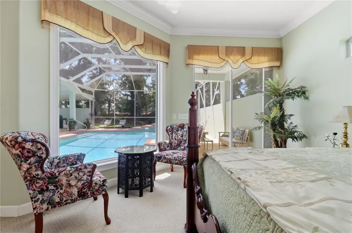 primary bedroom overlooking pool