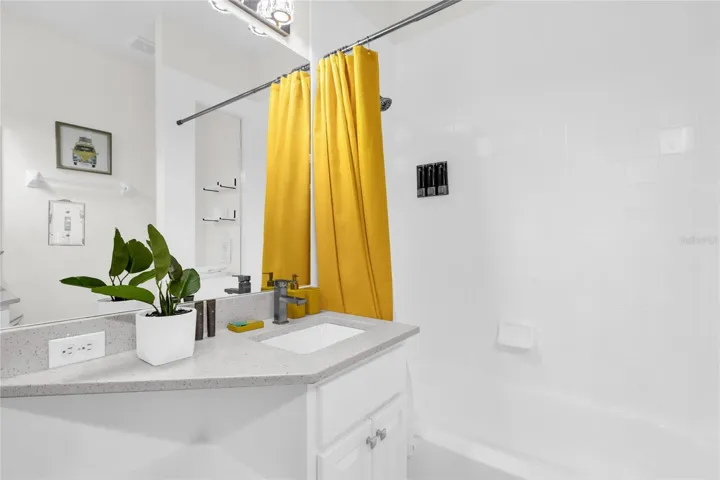 Bright guest bathroom with updated vanity and clean, modern finishes