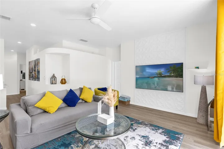 Inviting living room with contemporary design, open layout, and plenty of natural light—perfect for relaxing or entertaining