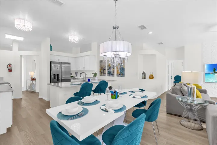 Open dining area connecting seamlessly to the kitchen and living room, creating an ideal space for gatherings and entertaining