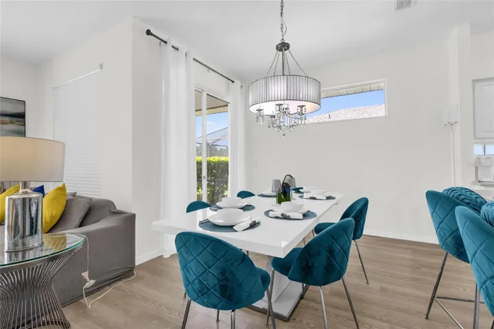 Bright dining area with open layout and natural light, perfect for entertaining