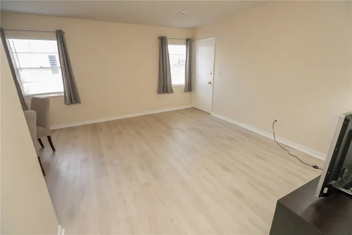 Freshly painted light and bright Living room with coastal vinyl flooring