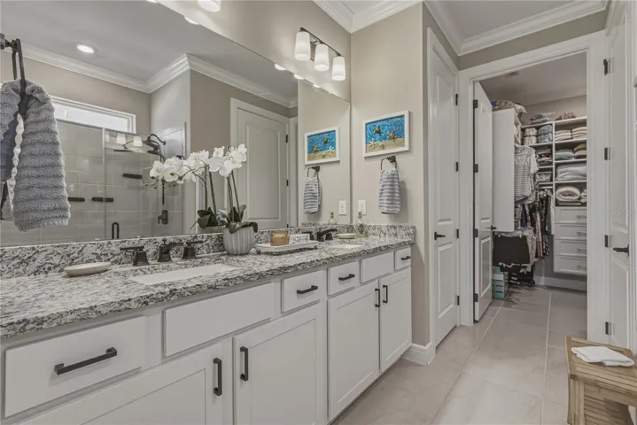 Primary Suite with upgraded Solid Wood Cabinetry, Undermount Sinks, Oversized Shower & Toilet Room