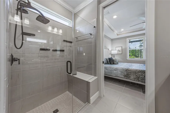 Custom Shower with Multiple Heads, Built in Shower Seat & Frameless Glass Door