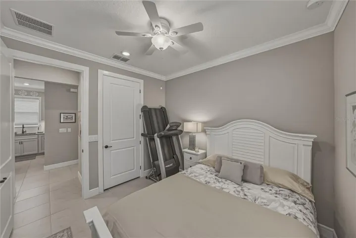 Second Bedroom with Crown Molding, Walk in Closet built in with California Closets