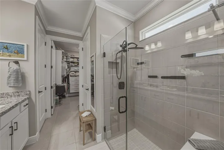 Custom Shower with Multiple Heads, Built in Shower Seat & Frameless Glass Door