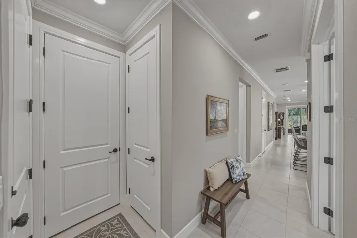 Front Entry Foyer with All 8 Foot Doors, Coat Closet, A/C Closet and access to Garage