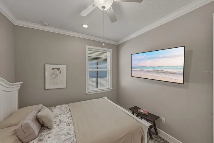 Second Bedroom with Crown Molding and upgraded Lighting Package