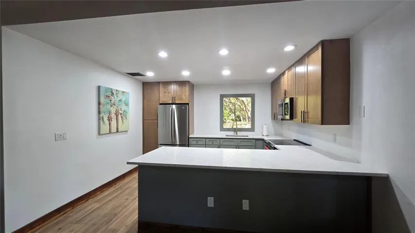 This clubhouse kitchen was recently renovated and ready for enjoying great meals while enjoying time with others.
