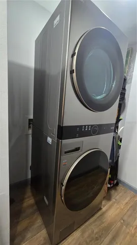 Full sized washer and dryer in the interior laundry area off of the kitchen. There are also shelves for your extra pantry items and storage on the other side of this.