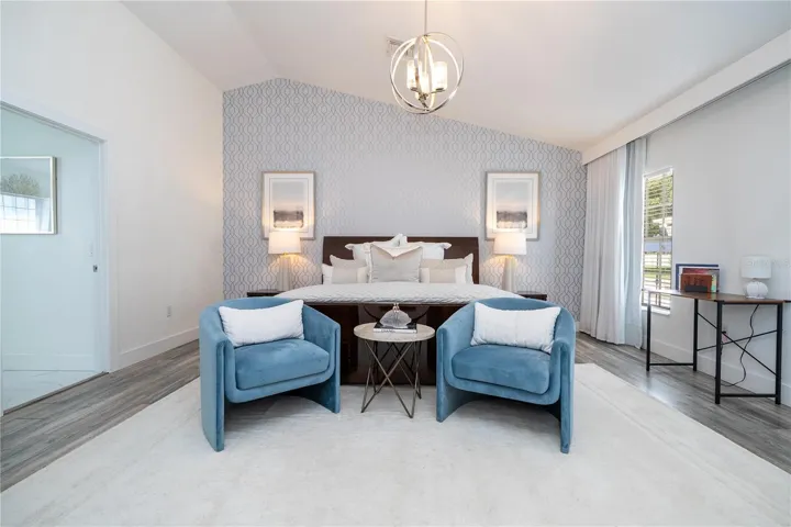 Serene primary suite offering comfort, space, and refined design.