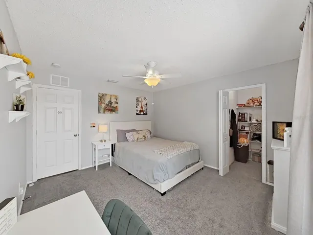 Bedroom with walk-in closet.