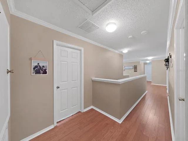 Upstairs hallway gives bedrooms and baths a bit of privacy.