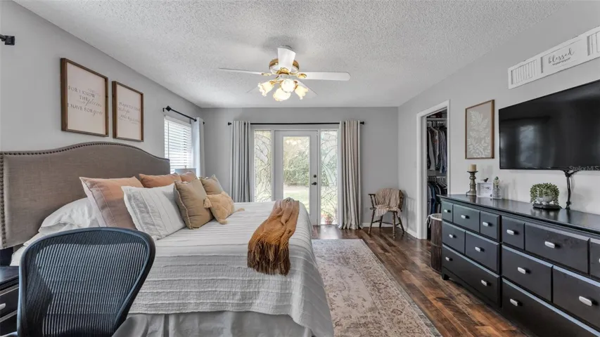 Primary bedroom is spacious and lets in tons of natural light