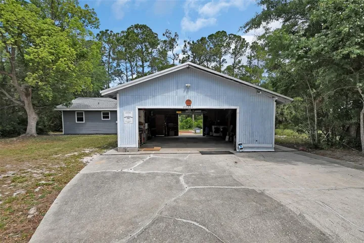 Front view showing garage and home behind