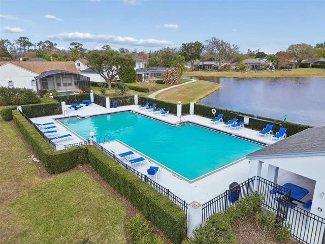 Residents of Emerald Forest enjoy community amenities including a pool, tennis courts, and a lakefront dock on Lake Crowell for fishing