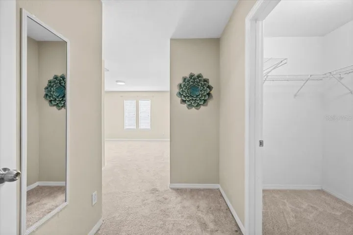 Entry Into Primary Bedroom Walk in closet on the right