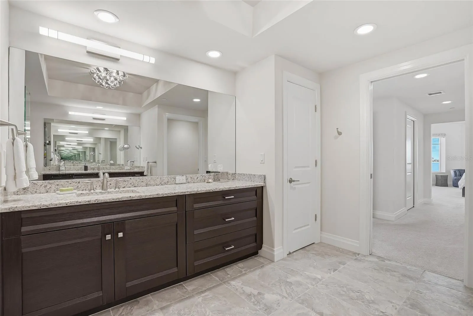 Double vanity in the primary + lots of storage .