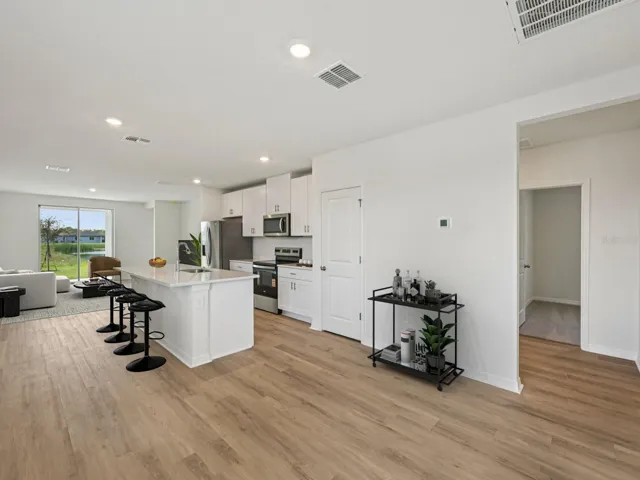 Interior photos are not of the actual home but are photos of the builder home with same floorplan with similar interior finishes and features. Photo uses virtual staging.