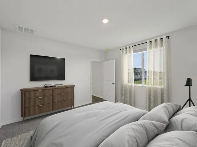 Interior photos are not of the actual home but are photos of the builder home with same floorplan with similar interior finishes and features. Photo uses virtual staging.