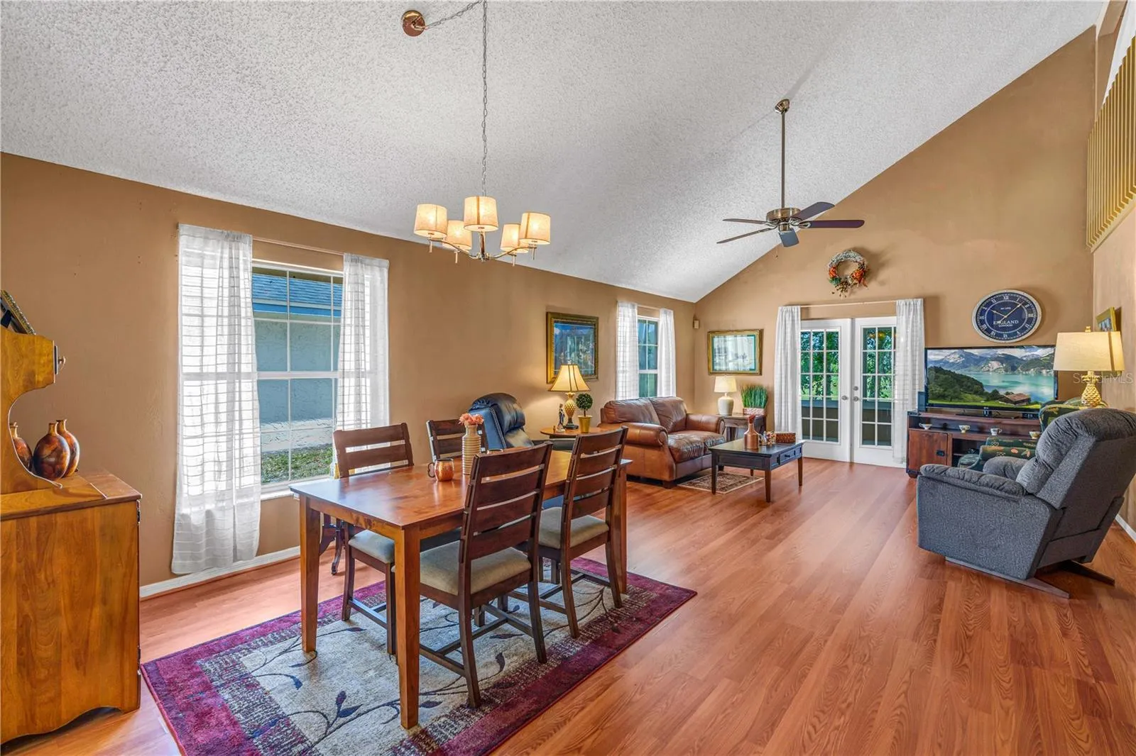 Dining Living Room with Vaulted Ceilings