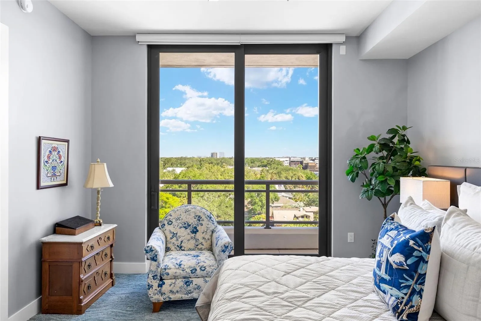 Primary bedroom with balcony access