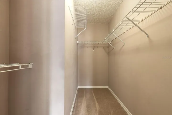 Walk-in closet in primary bedroom
