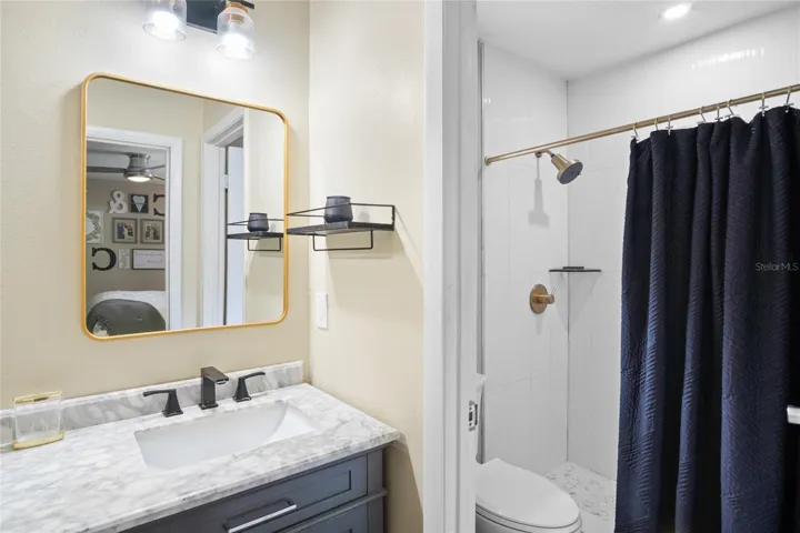 Looking into the separate water closet with shower.
