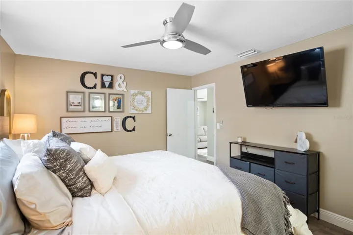 A view of the primary bedroom located off the laundry room and living room.