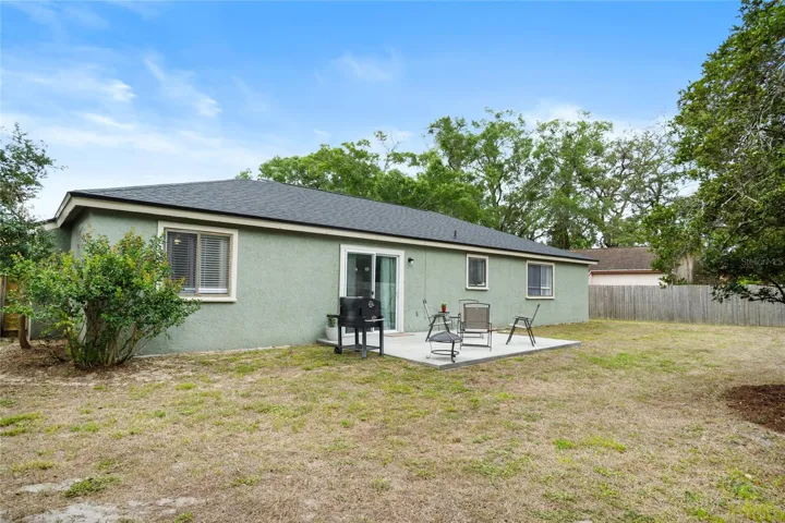 The rear of the home has plenty of space for entertaining or sending the kiddos out to play.