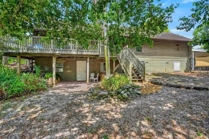 rear of home showing the door to the walk out basement