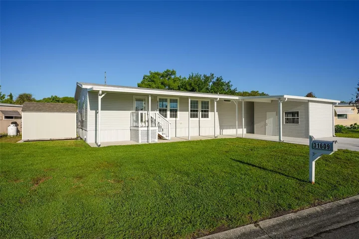 Welcome to 31609 Terrace Drive~ CHAIN OF LAKES CANAL FRONT HOME!
