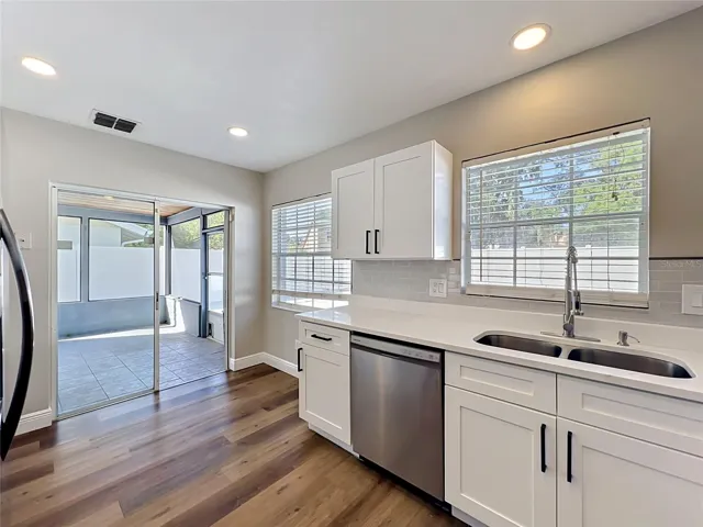 New Kitchen - Sliding glass door leading to the pool & all new hardware