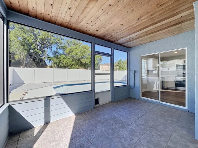 Screened in rear lanai with upgraded wood ceilings