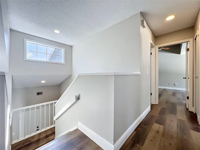 top of stairs with window providing additional sunlight