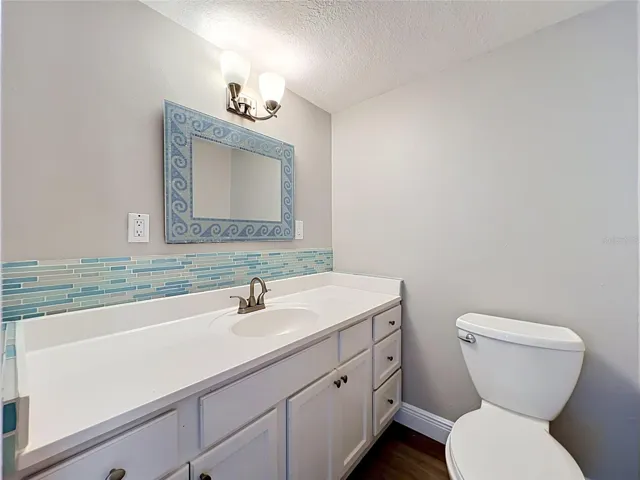 Half / Guest Bath - Downstairs with tile mosiac