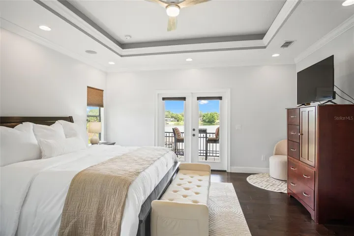 The primary suite provides a spacious room of sleek elegance.