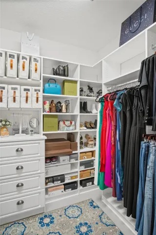 A walk-in closet made for those who love organization.