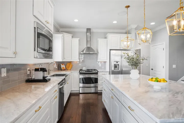 An exceptional kitchen with beautiful countertops and cabinets providing plenty of space for every chef to make masterpiece meals.