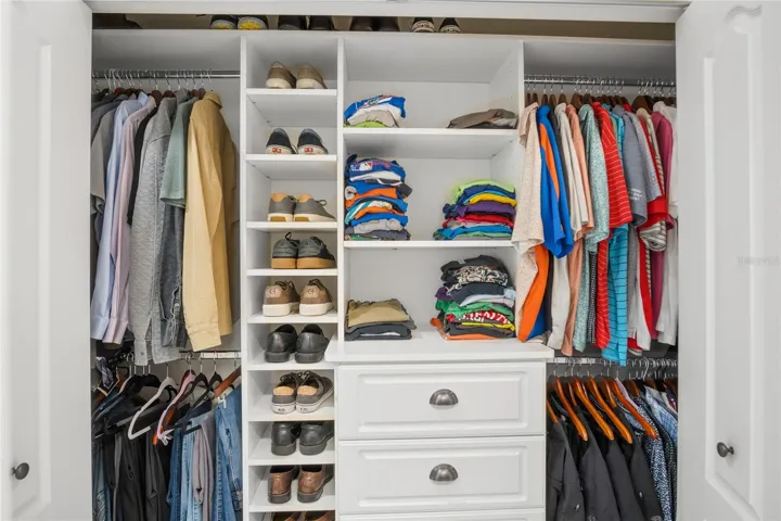 Perhaps it is not a walk-in closet; however, it is perfectly organized for the other half.