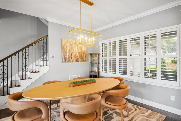 The dining room is located off of the entry and is open to the downstairs living space.