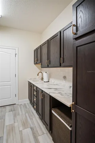 The laundry room provides plenty of space for folding clothes.