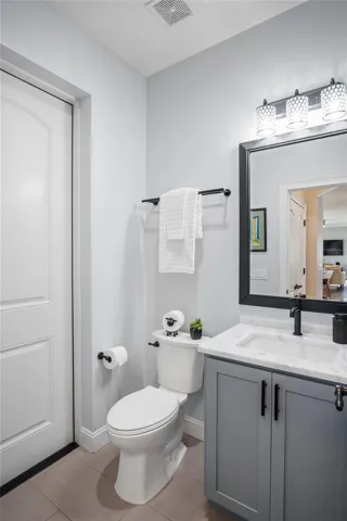 The downstairs guest bathroom has a shower and is in a perfect location if a pool is added to this home.