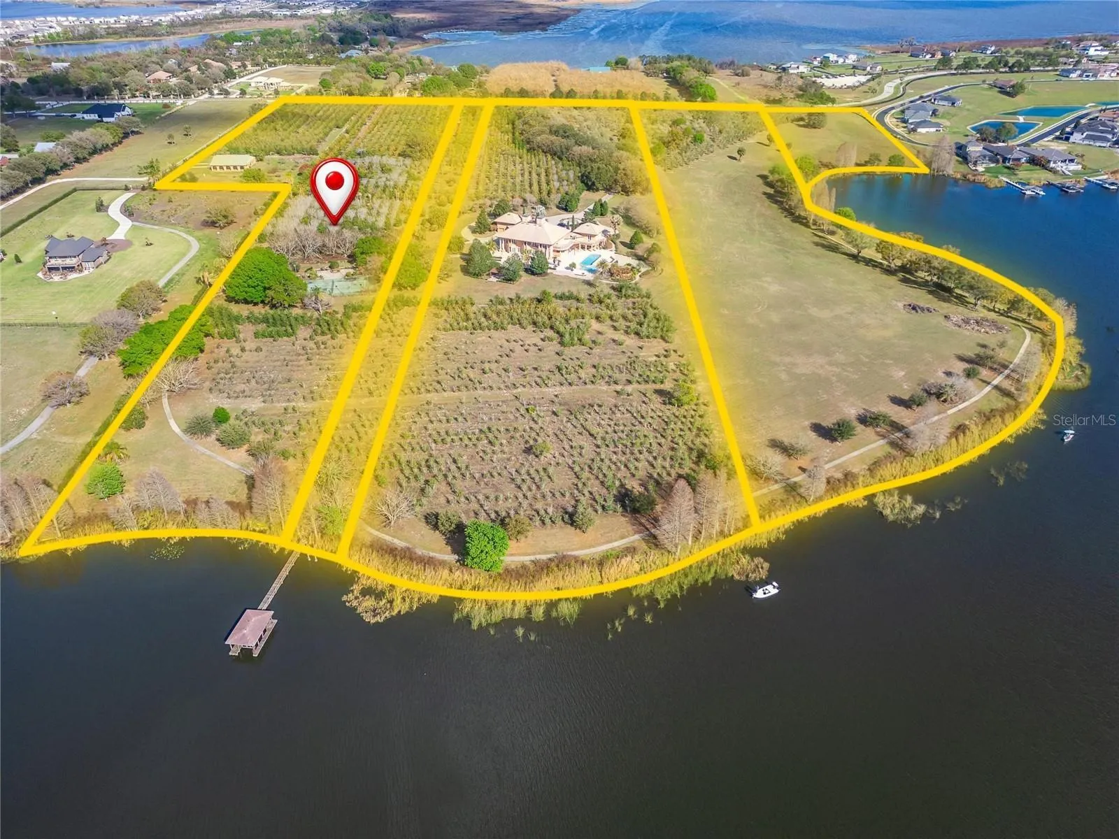 This parcel includes the tennis court, the barn, detached garage.