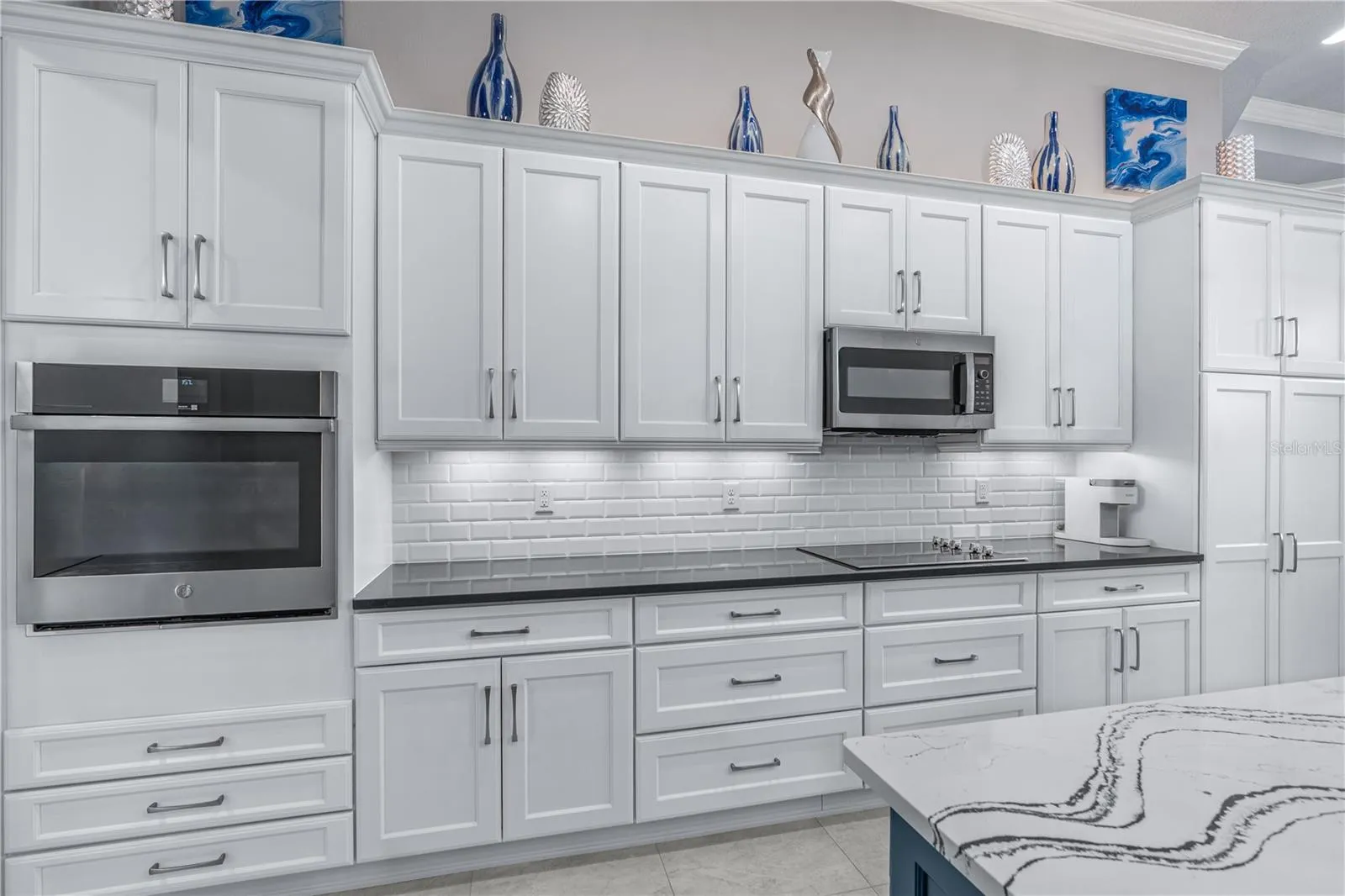 Gourmet Kitchen Extensive Custom Cabinetry