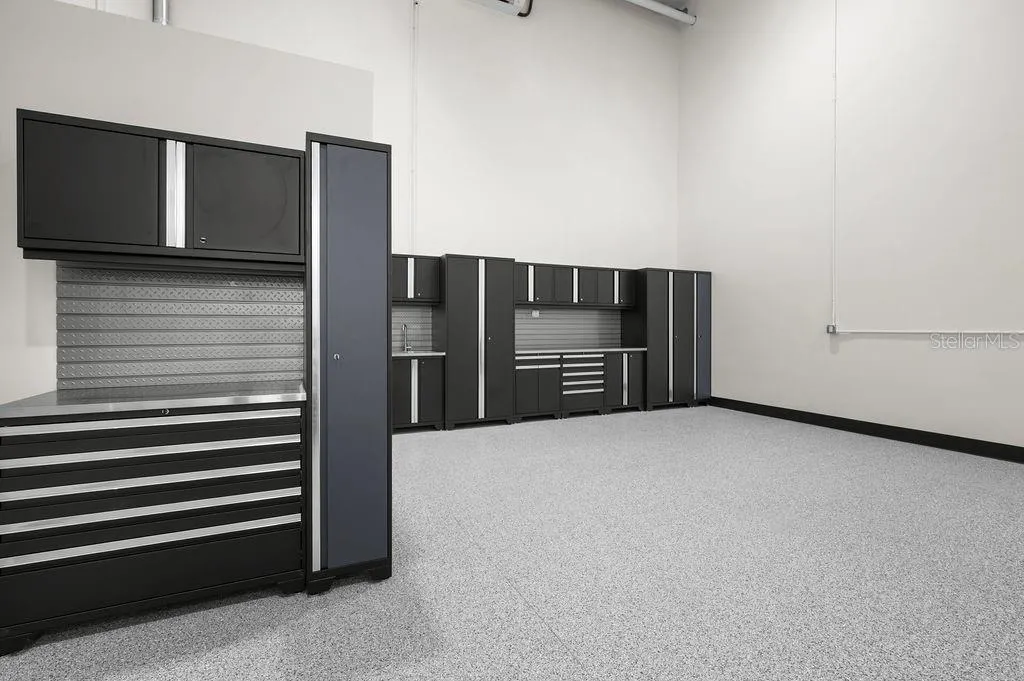New Age™ Performance Series cabinetry system with stainless work sink that conveys